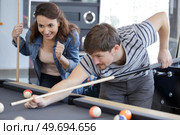 friends playing billiard man going hit a ball. Стоковое фото, агентство Ingram Publishing / Фотобанк Лори