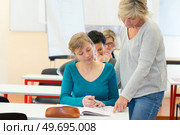 student and teacjer learning together. Стоковое фото, агентство Ingram Publishing / Фотобанк Лори