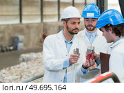 staff in an industrial interior. Стоковое фото, агентство Ingram Publishing / Фотобанк Лори