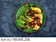 Chinese fried Pak Choi with shitake mushrooms. Healthy food. Baked organic Bok Choy. Стоковое фото, агентство Ingram Publishing / Фотобанк Лори