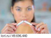 Woman trying to quit smoking. Стоковое фото, агентство Ingram Publishing / Фотобанк Лори