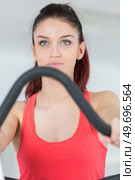 young girl training at gym on a stepping machine. Стоковое фото, агентство Ingram Publishing / Фотобанк Лори
