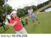 young couple on the golf course. Стоковое фото, агентство Ingram Publishing / Фотобанк Лори