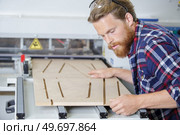 man working on a wood shaper. Стоковое фото, агентство Ingram Publishing / Фотобанк Лори