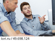 business male assistants making mistake. Стоковое фото, агентство Ingram Publishing / Фотобанк Лори