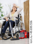 tired or troubled woman in wheelchair. Стоковое фото, агентство Ingram Publishing / Фотобанк Лори
