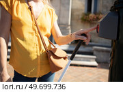 young blind woman pushing button to cross the street. Стоковое фото, агентство Ingram Publishing / Фотобанк Лори