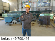 worker in work clothes with yellow helmet in factory. Стоковое фото, агентство Ingram Publishing / Фотобанк Лори