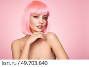 Beauty model portrait with pink hair. Bob short Haircut. Beautiful glamour Girl with short dyed hair. Стоковое фото, агентство Ingram Publishing / Фотобанк Лори