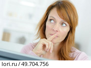 a woman is thinking about something. Стоковое фото, агентство Ingram Publishing / Фотобанк Лори