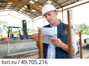 engineer man working with drawings inspection. Стоковое фото, агентство Ingram Publishing / Фотобанк Лори