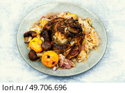 Pork knee baked in cabbage. Czech traditional food. Smoked pork ham hock or shank in sauerkraut. Стоковое фото, агентство Ingram Publishing / Фотобанк Лори