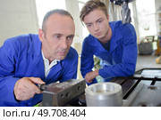 two men in the workshop. Стоковое фото, агентство Ingram Publishing / Фотобанк Лори