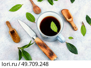 Cup of freshly tea with bay leaves. Top view. Bay leaf herbal tea or infusion. Стоковое фото, агентство Ingram Publishing / Фотобанк Лори