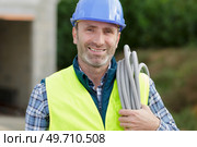 electrician with stubble before laying a cable. Стоковое фото, агентство Ingram Publishing / Фотобанк Лори