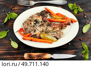 Fried tomahawk pork meat steak on wooden table. Top view. Roasted pork tomahawk steak. Стоковое фото, агентство Ingram Publishing / Фотобанк Лори