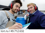 portrait of two factory workers. Стоковое фото, агентство Ingram Publishing / Фотобанк Лори