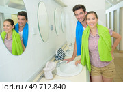 Portrait of couple in campsite sanitary block. Стоковое фото, агентство Ingram Publishing / Фотобанк Лори