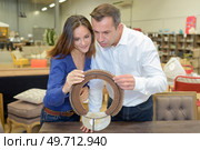 a couple at a furniture showroom. Стоковое фото, агентство Ingram Publishing / Фотобанк Лори