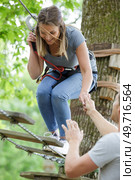 woman on the roping park. Стоковое фото, агентство Ingram Publishing / Фотобанк Лори