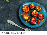Mushroom, champignons caps roasted stuffed with bell pepper. Homemade baked stuffed mushrooms, space for text. Plate with stuffed mushrooms. Стоковое фото, агентство Ingram Publishing / Фотобанк Лори