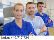 portrait of a boss and two apprentices all happy. Стоковое фото, агентство Ingram Publishing / Фотобанк Лори