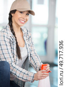 young beatiful cute girl holding orange plastic road cone. Стоковое фото, агентство Ingram Publishing / Фотобанк Лори