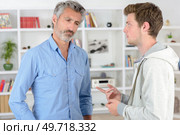 father and son having a conversation. Стоковое фото, агентство Ingram Publishing / Фотобанк Лори