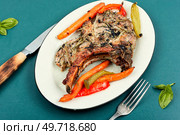 Delicious fried tomahawk pork meat steak. Roasted pork steak. Roasted pork tomahawk steak. Стоковое фото, агентство Ingram Publishing / Фотобанк Лори