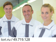 Portrait of three manual workers. Стоковое фото, агентство Ingram Publishing / Фотобанк Лори