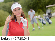 golfers women who are golfing view from the back. Стоковое фото, агентство Ingram Publishing / Фотобанк Лори