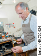 Shoe-repair store. Стоковое фото, агентство Ingram Publishing / Фотобанк Лори
