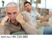 portrait of aging grieving man with his son. Стоковое фото, агентство Ingram Publishing / Фотобанк Лори