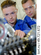 young mechanic is at work. Стоковое фото, агентство Ingram Publishing / Фотобанк Лори