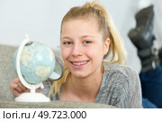 young woman holding a world. Стоковое фото, агентство Ingram Publishing / Фотобанк Лори