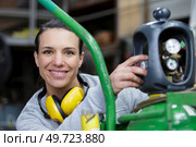 cheerful woman engineer in a boiler room. Стоковое фото, агентство Ingram Publishing / Фотобанк Лори