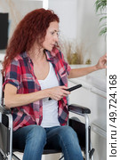 portrait of a disabled woman telecommuting. Стоковое фото, агентство Ingram Publishing / Фотобанк Лори