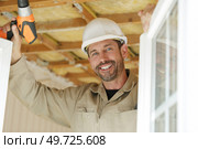portrait of a smiling window fitter. Стоковое фото, агентство Ingram Publishing / Фотобанк Лори