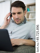 businessman having video call on computer in the home office. Стоковое фото, агентство Ingram Publishing / Фотобанк Лори