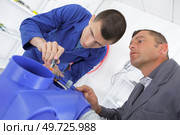 trainee and teacher working with blowtorch. Стоковое фото, агентство Ingram Publishing / Фотобанк Лори