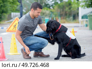 a dog handler at work. Стоковое фото, агентство Ingram Publishing / Фотобанк Лори