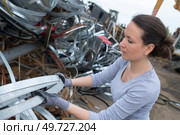 female worker at a scrap metals. Стоковое фото, агентство Ingram Publishing / Фотобанк Лори