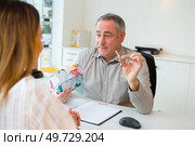skillful estate agent is working at office. Стоковое фото, агентство Ingram Publishing / Фотобанк Лори