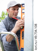 handy man is checking site outdoors. Стоковое фото, агентство Ingram Publishing / Фотобанк Лори