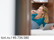 woman on a campervan bed. Стоковое фото, агентство Ingram Publishing / Фотобанк Лори