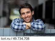 portrait of male farmer standing at stable outdoor. Стоковое фото, агентство Ingram Publishing / Фотобанк Лори