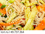 Salad with enoki mushrooms, carrots, cucumber, fried sesame seeds. Close up. Asian cuisine.. Chinese salad with enoki mushrooms, macro. Стоковое фото, агентство Ingram Publishing / Фотобанк Лори