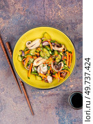Salad of squid, cucumber, onion and octopus. Korean cuisine with seafood. Korean octopus salad with cucumber. Стоковое фото, агентство Ingram Publishing / Фотобанк Лори