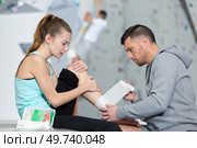 woman climber with the trauma and pain in the ankle. Стоковое фото, агентство Ingram Publishing / Фотобанк Лори