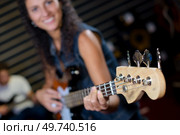 playing a guitar. Стоковое фото, агентство Ingram Publishing / Фотобанк Лори